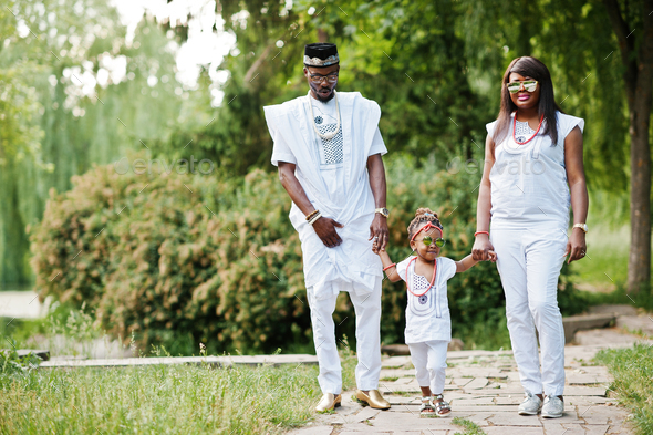 African american rich family at white nigerian national clothing