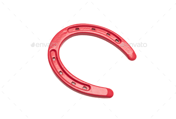 Horseshoe isolated cutout on white background. Red color horse shoe, good luck and fortune symbol