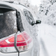 Car close-up on a winter road in snow covered forest. - PhotoDune Item for Sale