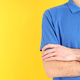 Man in blank blue polo on yellow background - PhotoDune Item for Sale