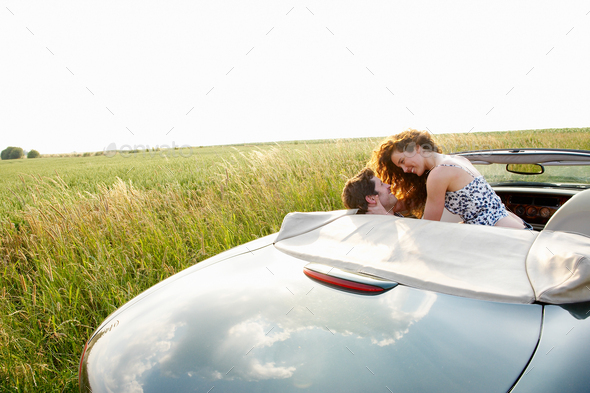 Couple in a convertible - Stock Photo - Images
