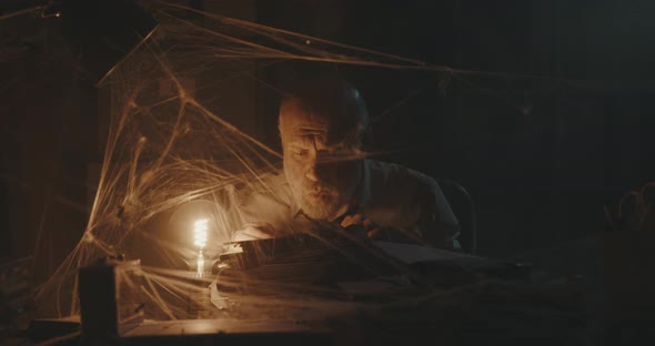 Businessman searching for old files in his abadoned office