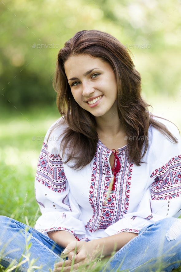 Slav teen girl at green meadow in national ukrainian clothing. Stock ...