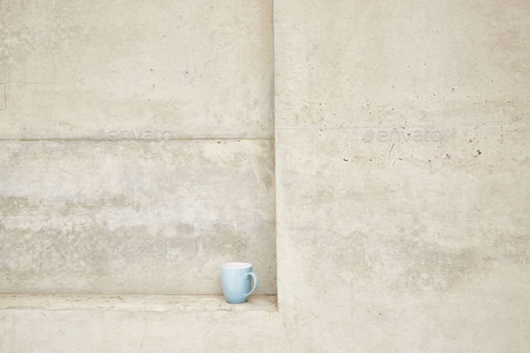 Cup in concrete ledge