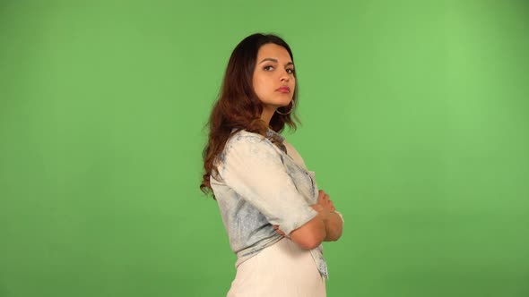 A Young Beautiful Caucasian Woman Thinks About Something  Green Screen Background