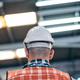 Back view of industrial engineer standing at a factory - PhotoDune Item for Sale