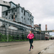 Woman running in an industrial zone - PhotoDune Item for Sale
