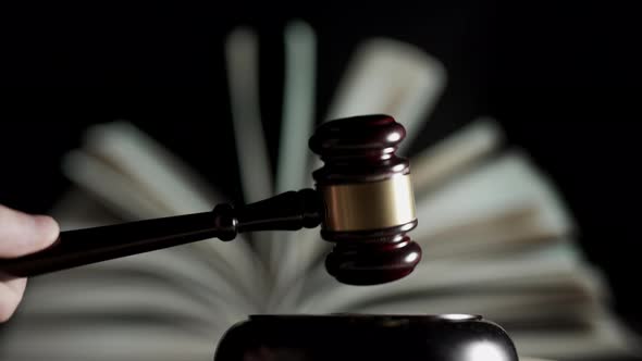 Judge is Hitting Gavel Off a Block in Courtroom alt