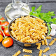 Fusilli whole grain in bowl with vegetables on black board - PhotoDune Item for Sale