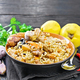 Pilaf with duck and quince in plate on towel - PhotoDune Item for Sale