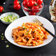 Classic italian pasta penne marinara with mussels and green onions on dark table - PhotoDune Item for Sale