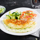 Omelette with green onions and sandwich with salmon on white plate - PhotoDune Item for Sale