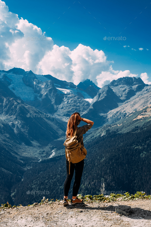 A woman is traveling in Caucasus, Russia. Mountain tourism in Russia - Stock Photo - Images