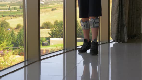 FES treatment Boy with foot drop system walking indoor alt