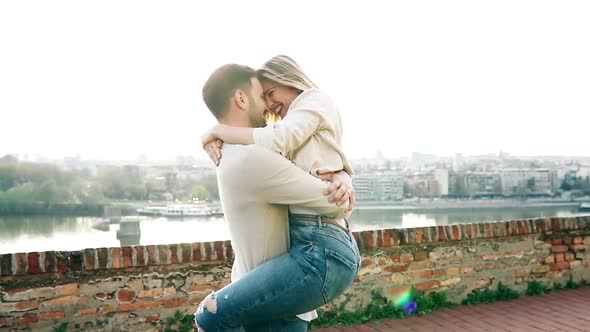 Beautiful Couple in Love Hugging and Smiling Outdoor
