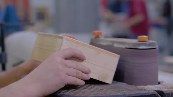 Man Carpenter Using Belt Sander Machine, Polishing Wood Product: Slow Motion