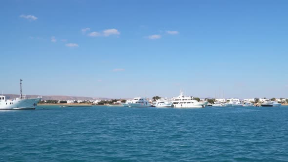 White yachts on the pier. The shore of the Red Sea in Egypt