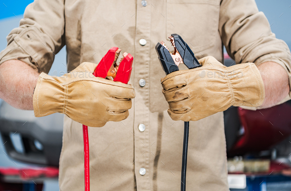 Car Mechanic with Jumper Cables in His Hands - Stock Photo - Images