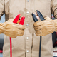 Car Mechanic with Jumper Cables in His Hands - PhotoDune Item for Sale
