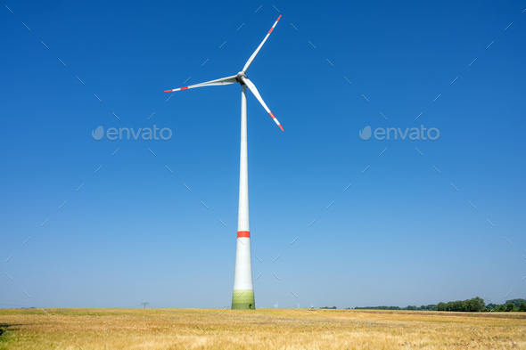 Modern wind turbine in a grain field - Stock Photo - Images