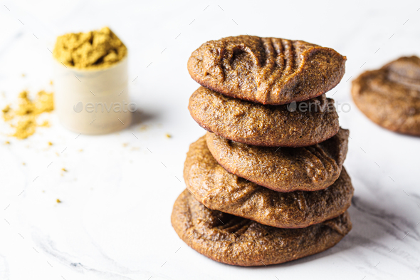 Protein homemade chocolate chip cookies on white marble background. Pea protein recipe.