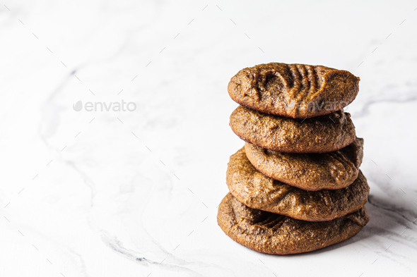 Protein homemade chocolate chip cookies on white marble background. Pea protein recipe.