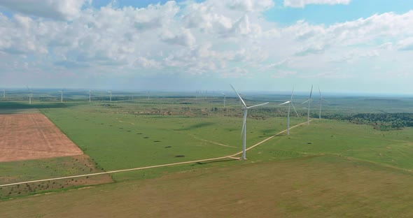West Texas Field of a Larger Wind Farm with Panoramic View Wind Blade Generators alt