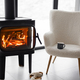 Cozy living space by the burning fireplace at snowy mountains - PhotoDune Item for Sale