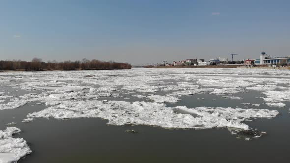 Moving Over Cold Iced River with Far Away Blue Sky alt