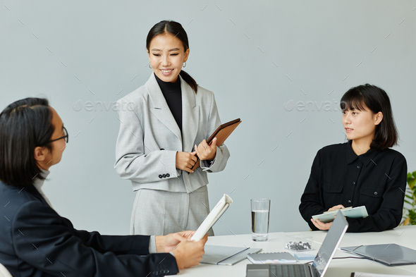 Smiling Female Boss Leading Meeting