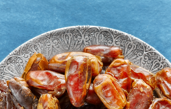 Dried dates on a plate. - Stock Photo - Images