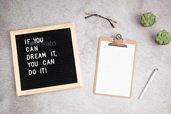If you can dream it, you can do it. Letter board with motivational quote with blank clipboard and