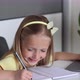 Caucasian Little Girl School Pupil Studying Online From Home Watching Web Class Lesson or Listening - VideoHive Item for Sale