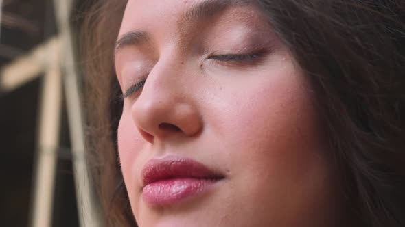 Close Up of Smiling Woman Girl Opening Her Beautiful Brown Eyes alt