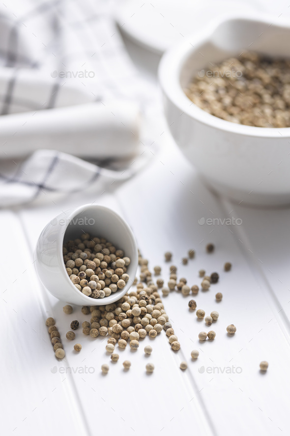 Whole pepper spice. White peppercorn grain in bowl - Stock Photo - Images