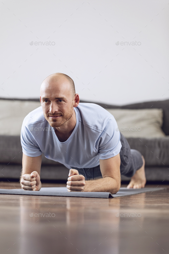 Man doing gymnastics at home
