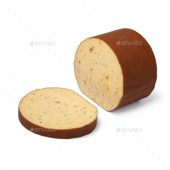 Piece and slice of Dutch smoked cheese with a mixture of herbs on white background - Stock Photo - Images