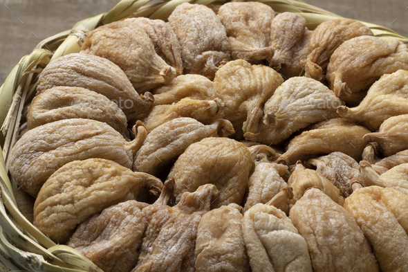 Traditional dried Turkish figs in a basket close up - Stock Photo - Images