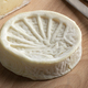 Single piece of French le Compostelle goats cheese close up - PhotoDune Item for Sale