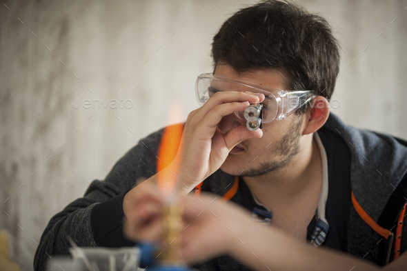 Two vocational school students experimenting with flame