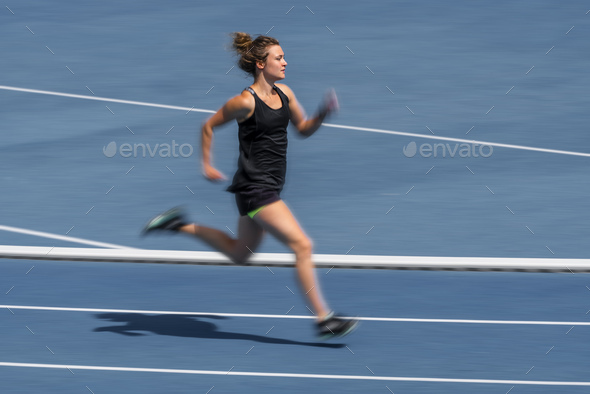 Female runner on tartan track