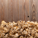 Wood shavings at table background. Wooden shaving on old plank board - PhotoDune Item for Sale