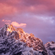 Beautiful mountain peaks in snow and violet sky with pink clouds - PhotoDune Item for Sale