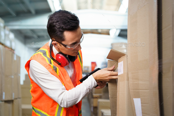 Employee of a logistics warehouse takes an inventory of goods