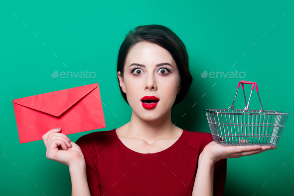 woman with red envelope and shopping basket