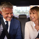 Smiling Businessman And Businesswoman In Back Of Taxi Driving To Office Meeting Together - PhotoDune Item for Sale