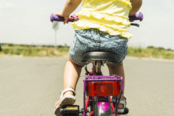 little girl riding bike