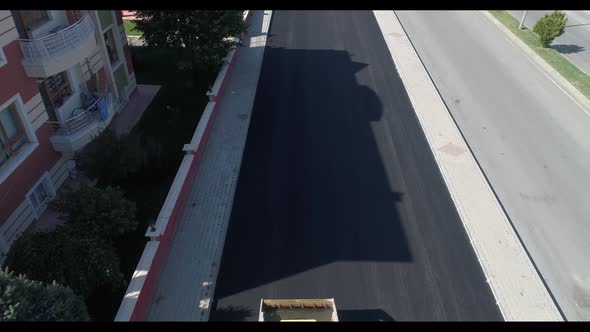 Vertical Video A Yellow Paver Flatten New Hot Asphalt