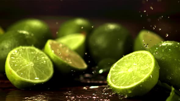 Super Slow Motion on Half the Juicy Lime Dripping Water alt