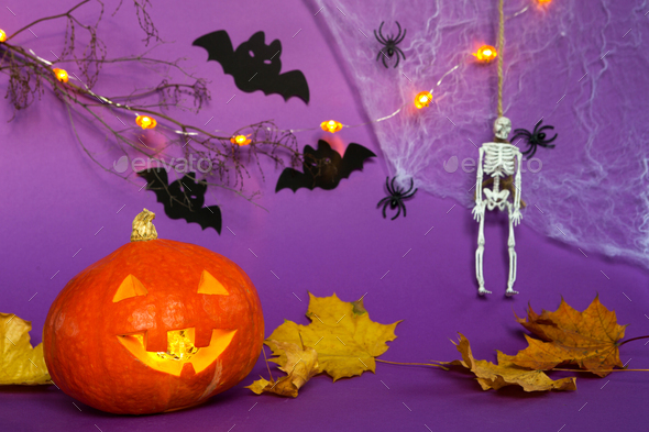 Halloween backgrounds of Jack lantern pumpkin, spider web, skeleton on a rope, spiders